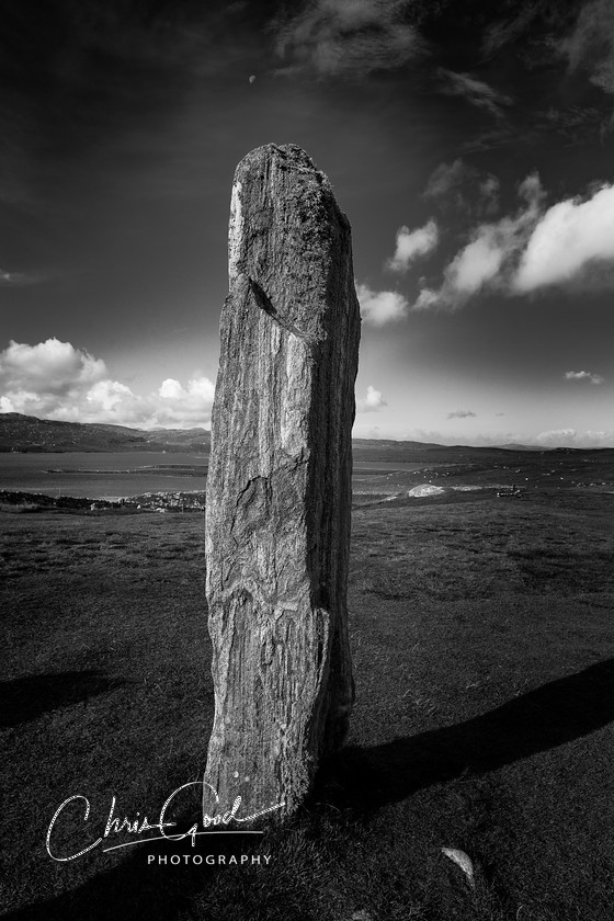 Calanais texture 
 Watching over the beautiful landscape of the Isle of Lewis for 5,000 years, the stone circle at Calanais is truly spectacular. I was drawn to the textures in the rock and the position of the moon for this image. 
 Keywords: Calanais, Callanish, Stone Circles, UK Stone Circle, UK History, Scotland, Outer Hebrides, Isle of Lewis, Black and White photography, Chris Good