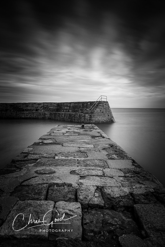 Safe Harbour 
 Keywords: Harbour, Scotland, UK, Coastal photography, Cloud photography, weather, Black and White, BNW, B&W, Chris Good, seacape, harbour wall, stone work,